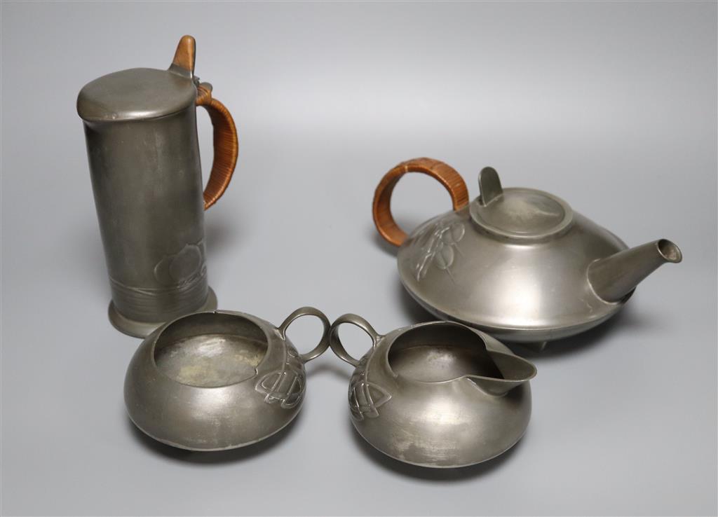 A Libertys Tudric pewter three piece tea set, shape no.0231 and a Libertys Tudric pewter cylindrical jug, shape no.0280, the latter 2